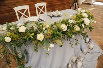 Wedding presidium for the newlyweds, on the wedding day at the party.