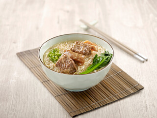 Stewed Beef Brisket Noodle with chopsticks served in a bowl isolated on mat side view on grey background