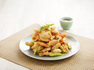 Stewed Sea Prawn with Superior Stock with chopsticks served in a dish isolated on mat side view on grey background
