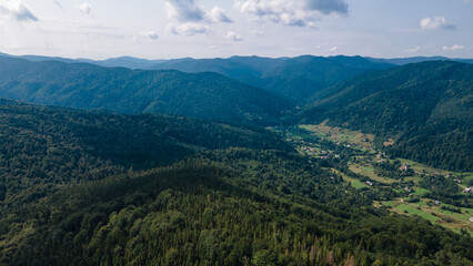 Fototapeta na wymiar Mountains forest from a height landscape