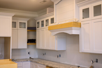 Installing and assembling modern kitchen cabinet furniture in new home