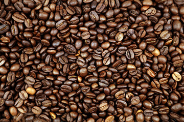 Close-up of roasted brown coffee beans background
