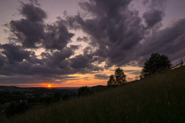 Fototapeta na wymiar Sunset on a mountain slope in the Beskids
