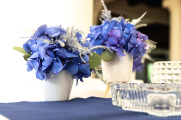 Arrangement for a wedding reception made form a fresh blue Hydrangea