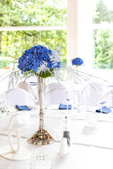 Arrangement for a wedding reception made form a fresh blue Hydrangea