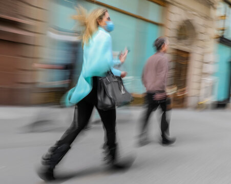 Blurred image of a woman with a bag