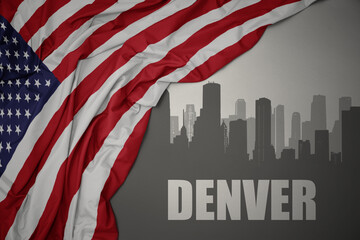 abstract silhouette of the city with text denver near waving national flag of united states of america on a gray background. - obrazy, fototapety, plakaty