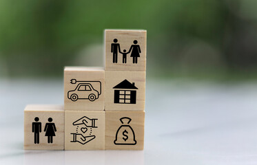family icon concept on wooden cube on table.