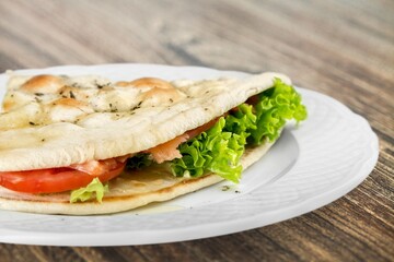 Tasty sandwich with vegetables, ham and cheese, traditional restaurant menu dish, food cooking recipe book cover.