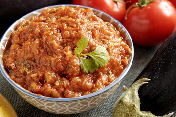 Eggplant and tomato salad Zaalouk dish in bowl. Homemade cooked vegetable salad from Moroccan cuisine.