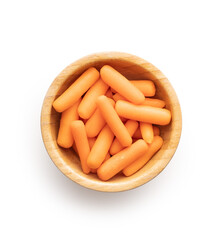 Baby carrot vegetable in bowl. Mini orange carrots isolated on white background.