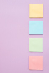 Different sticky notes on pink background