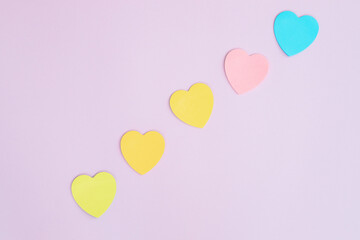 Obraz na płótnie Canvas Sticky notes, heart shaped, rainbow colored line.