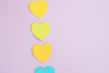 Sticky notes, heart shaped, rainbow colored line.