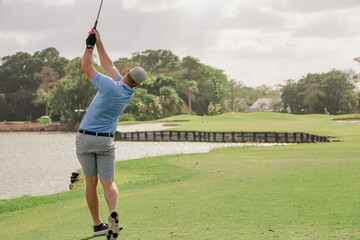a golfer in the tee box on a par 3