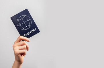 Banner with woman hand holding passport on violet background. Travel concept. Identity, nationality...