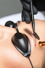 Removal of permanent makeup on the eyebrows.Carbon face peeling in a beauty salon. Hardware...