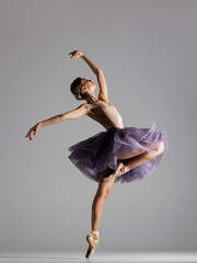 young beautiful ballet dancer posing in a studio