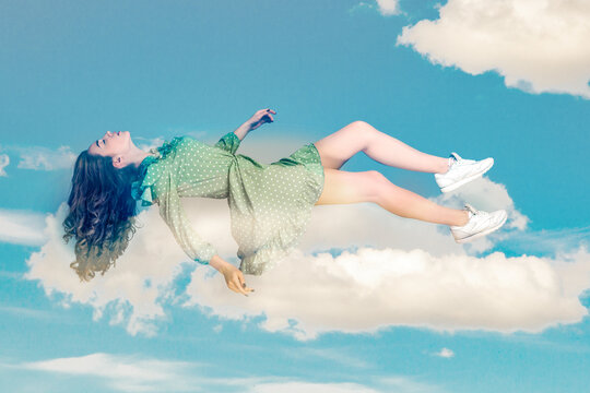 Floating in air. Relaxed girl in vintage ruffle dress levitating keeping eyes closed, sleeping while flying mid-air having comfortable peaceful dream in sky. collage composition on day cloudy blue sky