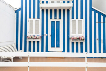  creative colored striped blue lodges house in a Portuguese fishing resort town on the beach by the...