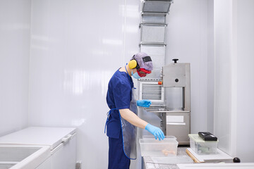 A researcher works with materials for experiments