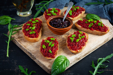 Bruschetta with grated beetroot, herbs and caramelized onion