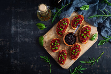 Bruschetta with grated beetroot, herbs and caramelized onion. Top view