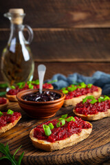 Bruschetta with grated beetroot, herbs and caramelized onion