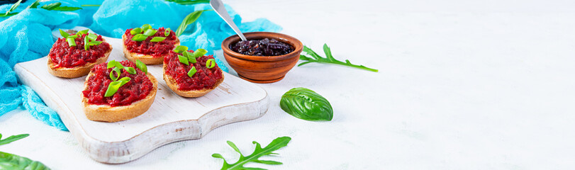 Bruschetta with grated beetroot, herbs and caramelized onion