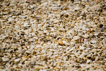 Beige stones background. Selective focus.