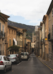 Fototapeta na wymiar Facade of an ancient building. Background of an old street, Soller, Mallorca.