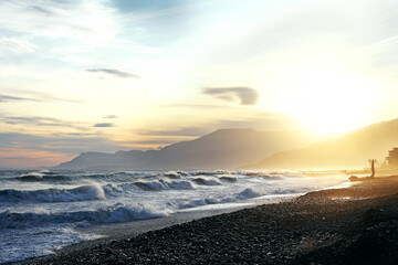 Ligurian coast. Waves. Sunset. Beach italy sunset