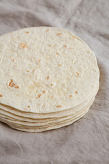 Homemade Mexican Corn Tortillas in a Stack, side view.