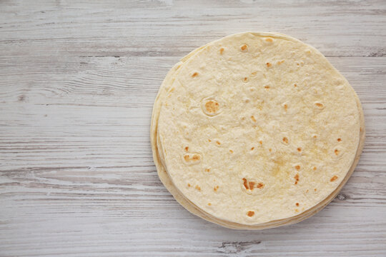 Homemade Mexican Corn Tortillas in a Stack, top view. Flat lay, overhead, from above. Copy space.