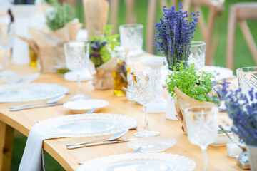 Lavander flower table decorations for holidays and wedding dinner. Wedding table decoration in rustic style with lavander