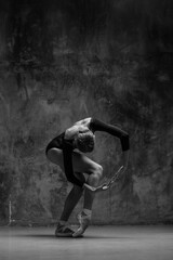 Fototapeta Young beautiful ballerina is posing in studio obraz