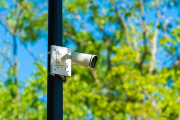 Outdoor surveillance camera on a pole in a public place.CCTV camera.