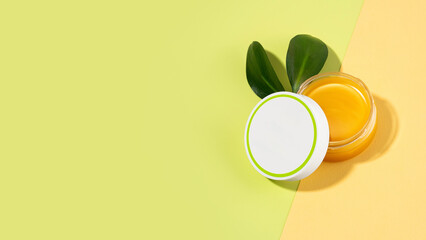 An open tin of foot balm with sheep's wool grease. Lanolin cosmetics for self-care, a jar of...