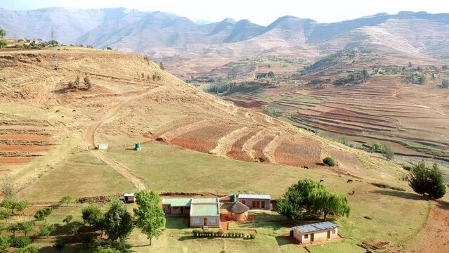 Lesotho mountains by sunrise Lesotho farmhouse 
rural Lesotho