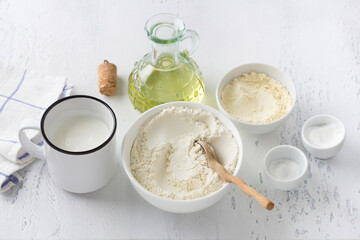 Ingredients for baking buns: wheat flour, corn flour, yogurt, vegetable oil, salt, baking powder on...