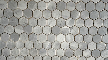 Gray Tiled Wall. Mosaic tile installation. The texture of the mosaic tiles in grey.
