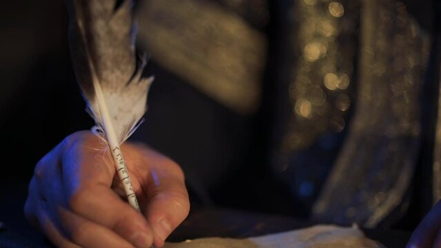 Eagle feather pen. Writing in ancient times. Arabic scripts. Embroidered pen. Historical background concept.