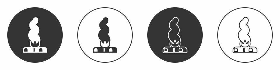 Black Campfire icon isolated on white background. Burning bonfire with wood. Circle button. Vector
