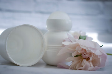 Obraz na płótnie Canvas Deodorant flower peony on a light background