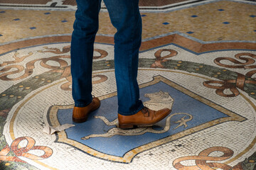 Man circles three times on the floor mosaic bull's testicles, it is believed it brings lucky to the...