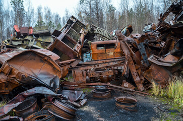 Piles of old rusty soviet crushed trucks in scrap metal yard. Car recycling