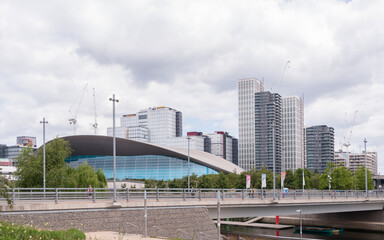 Construction and residential or retail development buildings. Cranes and equipment.  Adjacent London aquatics centre to the Olympic Park, in London, United Kingdom, June 13, 2022