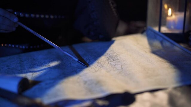 The commander who worked on the map in the ancient period. Soldier marking on map with bow arrow. Historical background.