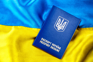 Fabric curved flag of Ukraine, UA. Blue and yellow colors.Ukrainian passport.Stop...
