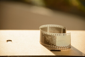 close up of a film in the afternoon golden hour on a table
